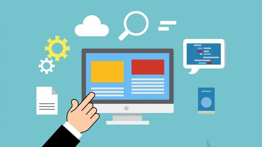 Une main pointe vers un écran d’ordinateur qui affiche un site Web.