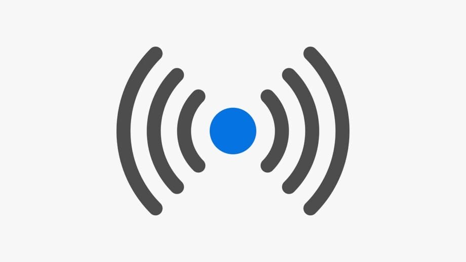 Icône d'un cercle bleu avec des lignes courbes grises concentriques des deux côtés, ressemblant à un symbole de signal sans fil.