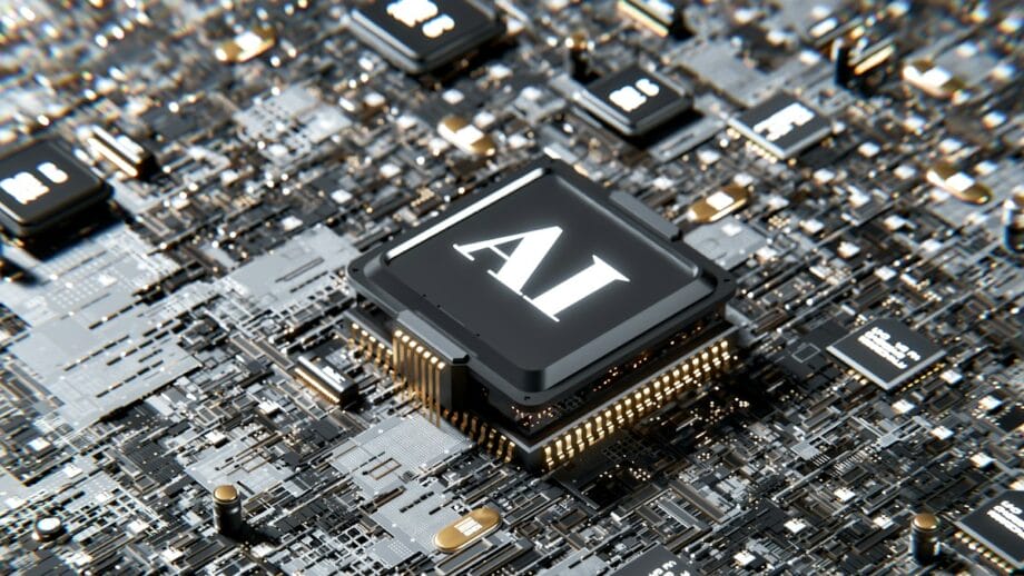 Gros plan d'une carte de circuit imprimé complexe avec une puce centrale proéminente étiquetée "AI" entourée de petits composants.