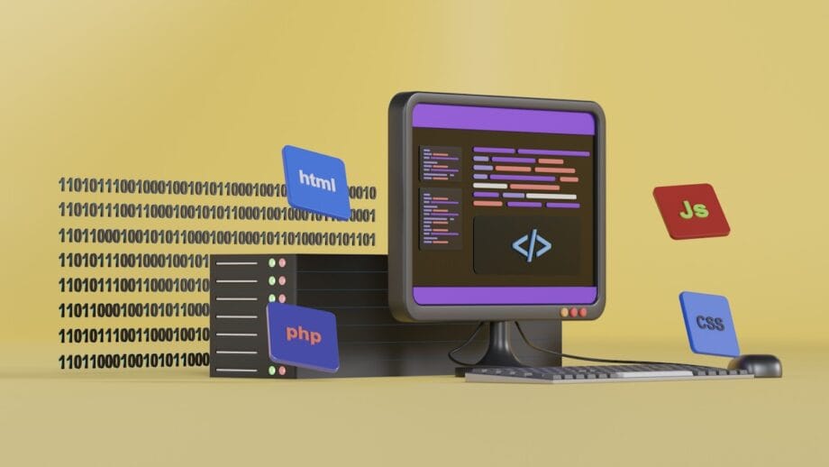 Un écran d'ordinateur affiche du code avec des icônes HTML, PHP, JavaScript et CSS flottantes sur fond jaune. Du code binaire et un clavier sont également présents.